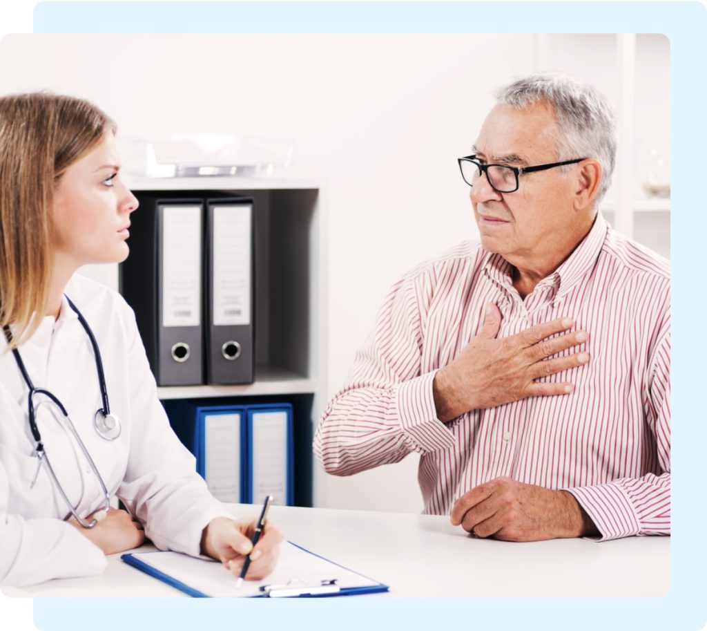 Doctor listens to elderly man’s symptoms as part of a mesothelioma diagnosis process