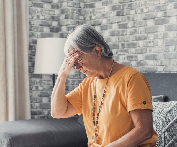 Sad,Depressed,Middle,Aged,Mature,Woman,Sitting,Alone,At,Home