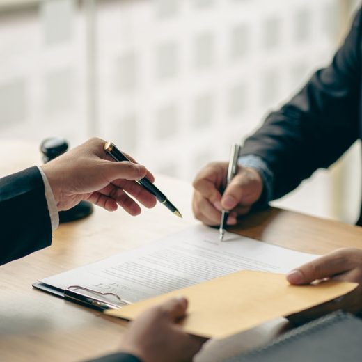 Business,People,Or,Lawyers,Discussing,Contracts,Or,Business,Deals,At